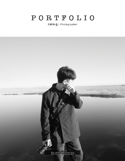 Chen.Q standing beside the ocean with a camera