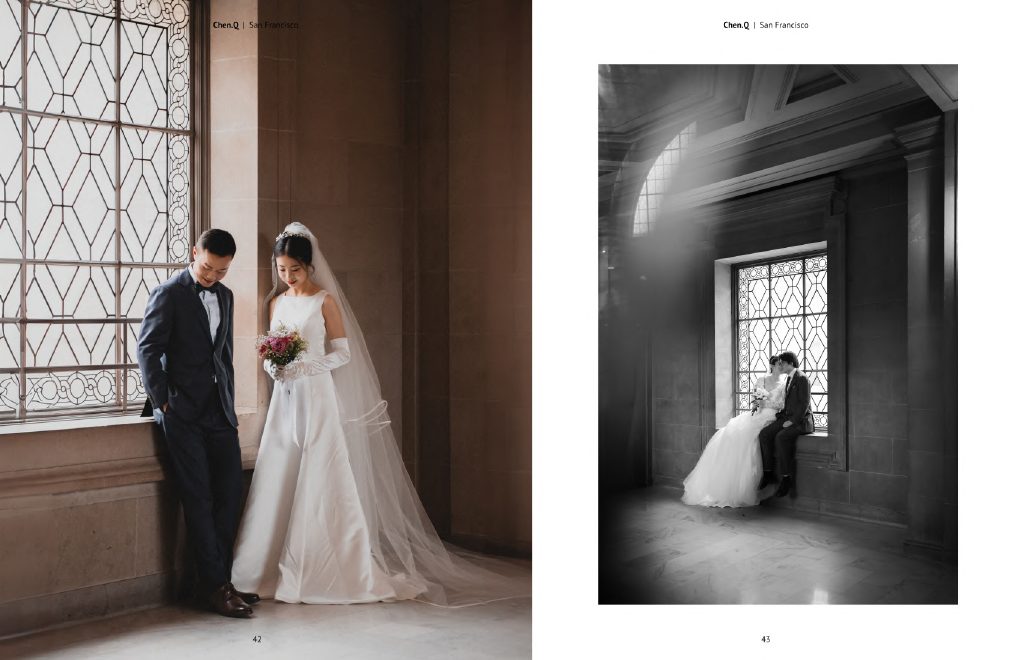 Bride and groom beside a tall window