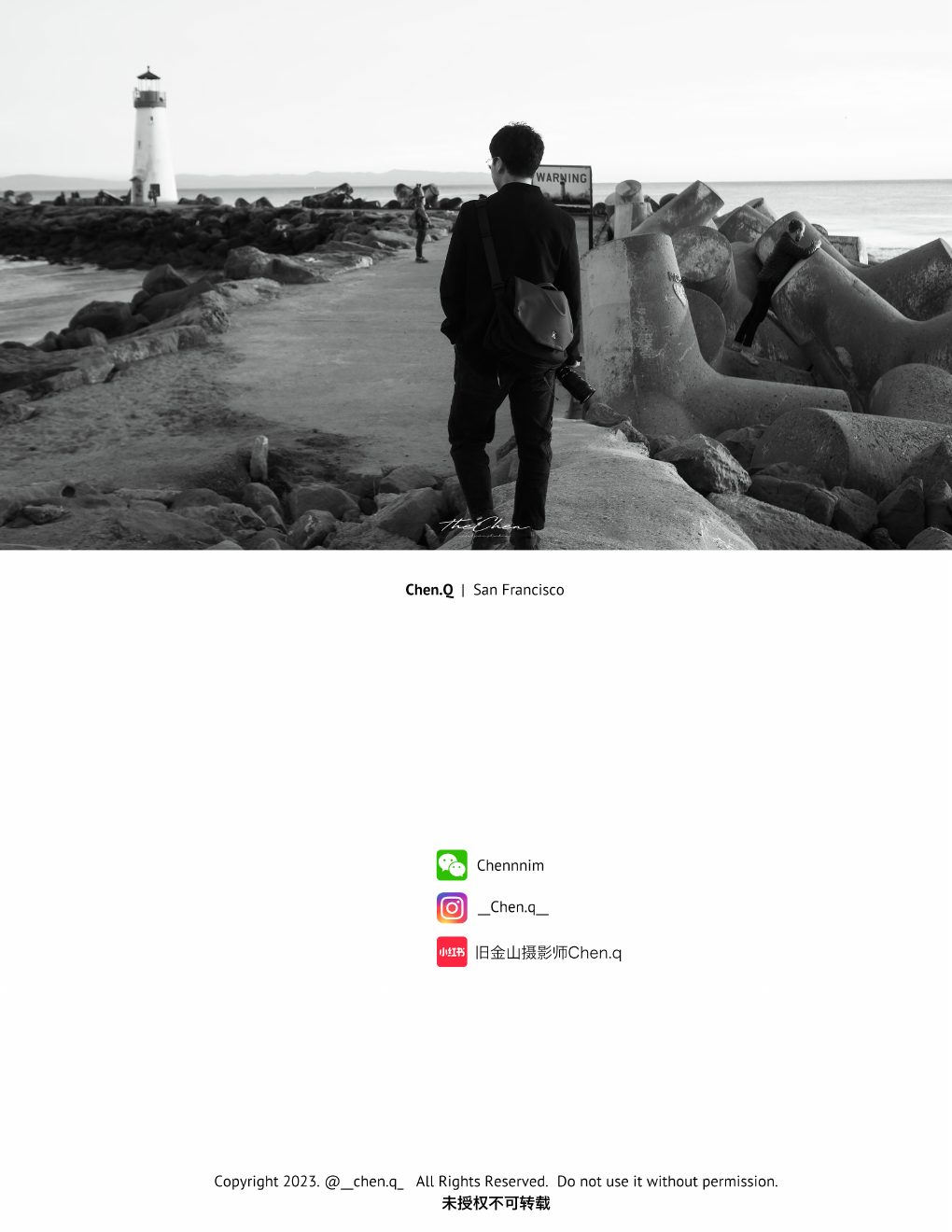 Photographer walking toward a lighthouse